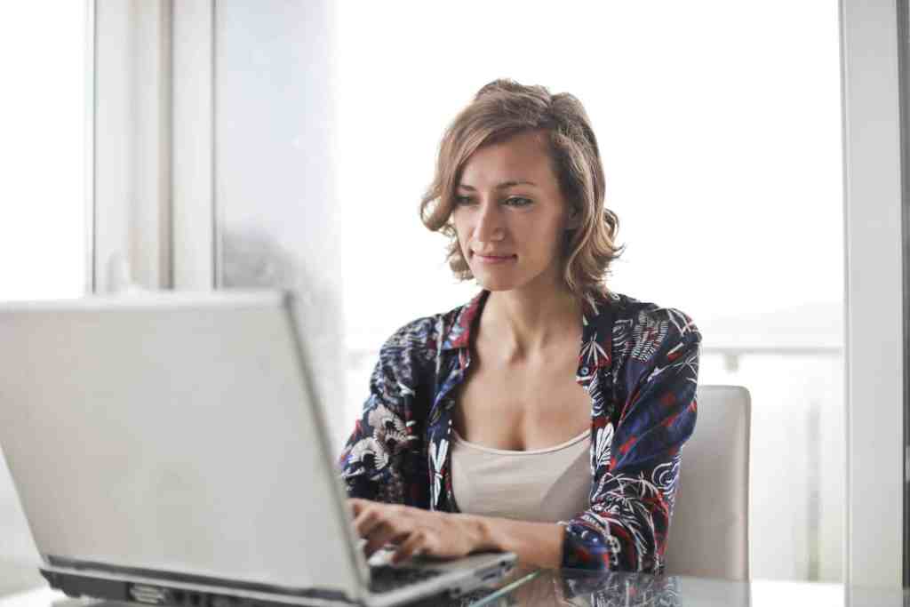 Business professional using Text Blast SMS marketing integrations on a laptop